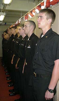 starboard: cadets in the sophomore/junior male hold await the Captain's arrival.