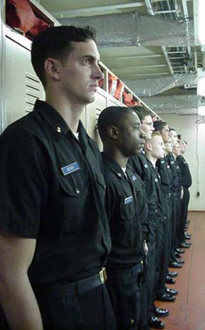 port: cadets in the sophomore/junior male hold await the Captain's arrival.