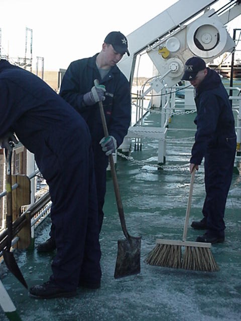 sweeping snow: 3/c cadets Nathan Weymouth(Ipswitch,MA) and Jonathan Rand (Brockton,MA) sweep down the weather decks