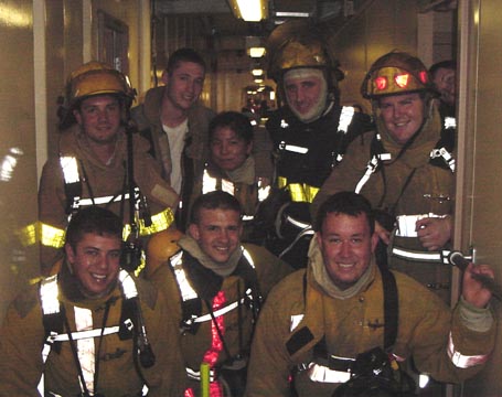 firefighters 1: Member of the at sea fire team smile, before a drill.