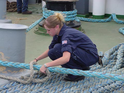 stopper: 4/c Carolyn Keely (Maynard,MA) learns how to apply a stopper to a mooring line- ready for arrival.