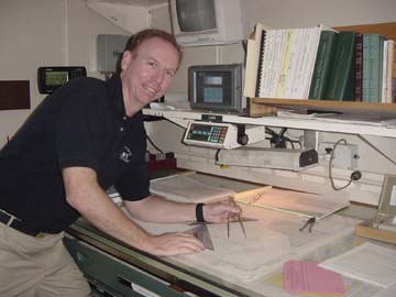 Cdr Dave Mackey: at work in the chartroom
