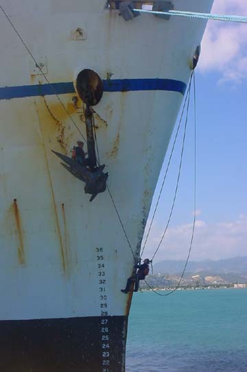 starboard anchor: resembling mountain climbers in the alps, cadets scramble up to paint the hook.(photo taken in Ponce)