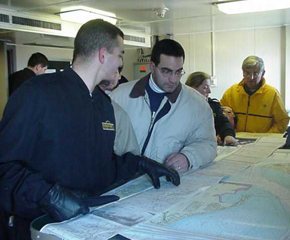 chartroom: cadets point out the charts to family members
