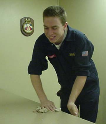 cleaning tables: because the mess deck is always open at sea... cleaning is a constant activity.