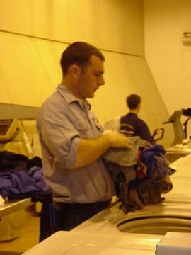 laundry: 1/c Pat Donovan (Newport,RI) does laundry prior to port