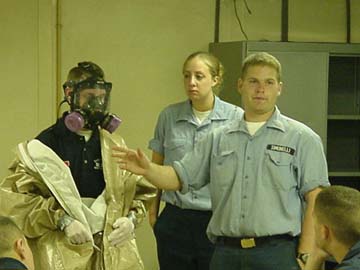 Mike Simonelli: (Londenderry,NH) and Beth Quitadamo (Worcester,MA), both in the class of 2002, instruct in the science of respirators and personal safety.