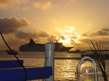 sunsets: The caribbean sun sets behind a cruise ship... don't you wish you were here?