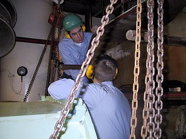 Nirex Evaporator Open: Cadets clean the Nyrex evaporator prior to getting underway.