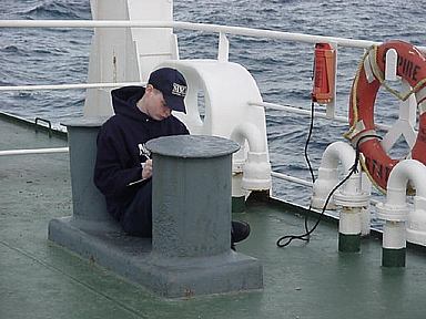 Studying on the bow: finally we get a changing water view and a moving deck under our feet... but the studies always need attention.