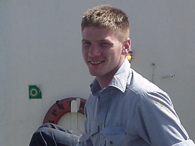 Irish.jpg: 3/c Ryan Wood, Marshfield,MA, enjoys the sun out on deck.