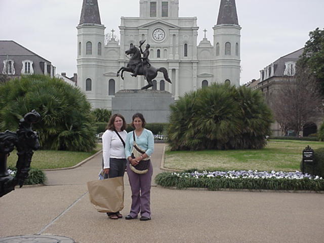Jackson Sq.: 2/c Megan Kearns and 3/c Angela Abbot pose in front of the statue of Andrew Jackson. St. Louis Cathedral is in the background.