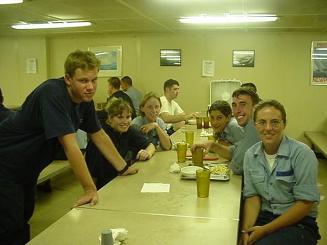 Messdeck.jpg: Cadets at dinner after the drills: 2/c Mark Weissman, Wouburn,MA; 3/c Kaitlyn Flynn, S.Boston,MA; 2/c Katie Coan,Brimfield,MA; 3/c Angela Abbot, Sandwich,MA; 1/c Dennis Kenny, Andover,MA; and 3/c Mary Gagnon, S.Boston,MA.