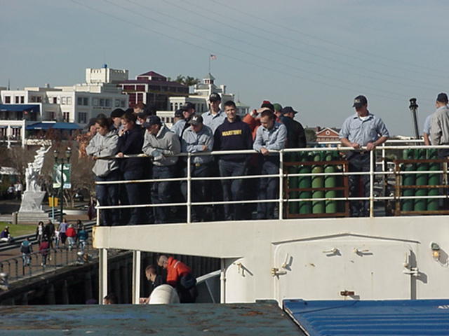 NOLA docking stern.: Vulture's row. Cadets watch the docking in New Orleans from the docking bridge aft.